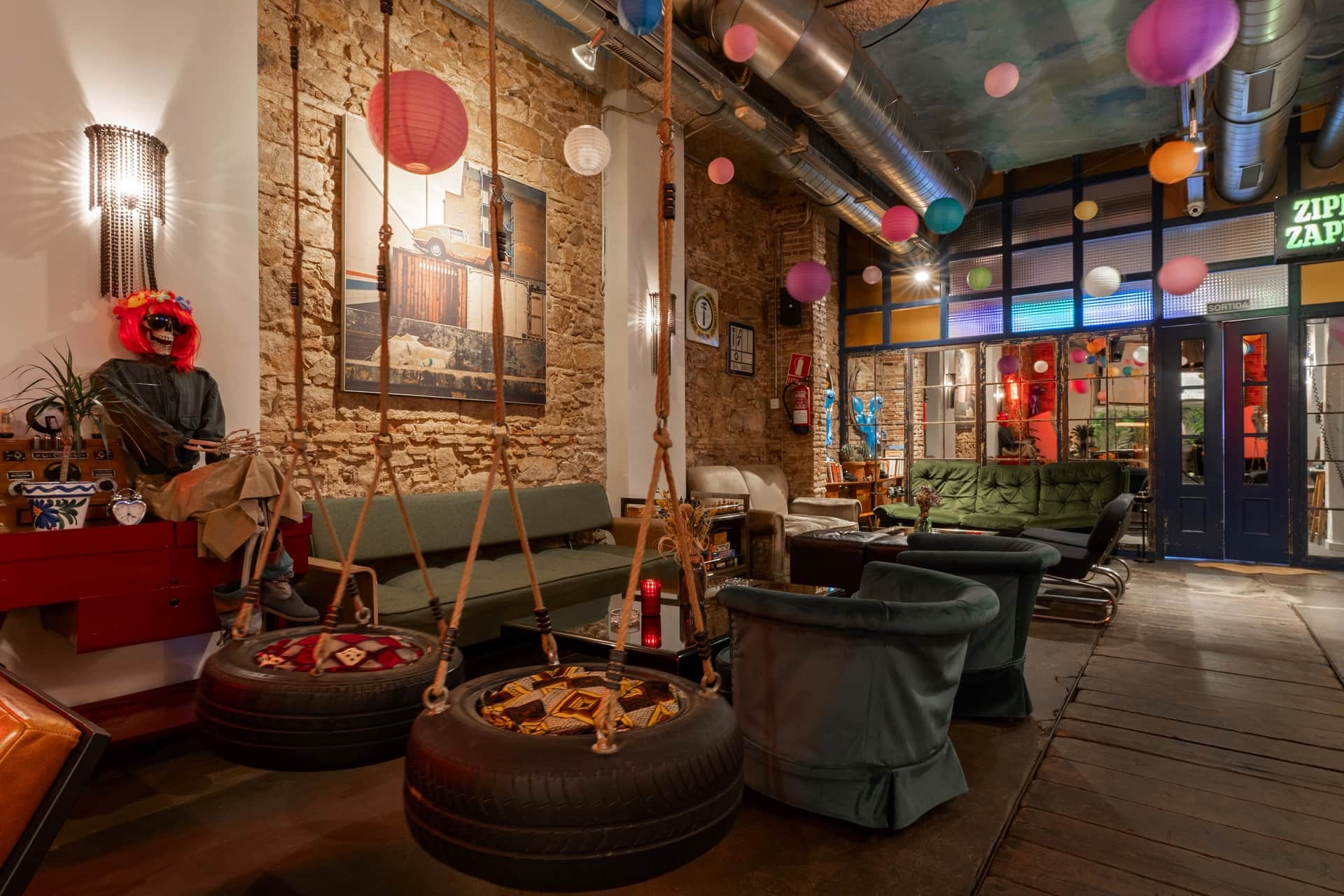 Lounge area with swings and quirky decor at the social cannabis club Dr. Dou Barcelona