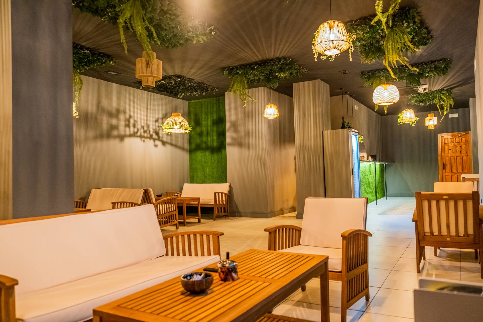 Nature-inspired interior of the cannabis association Shambala in Valencia with wooden seating