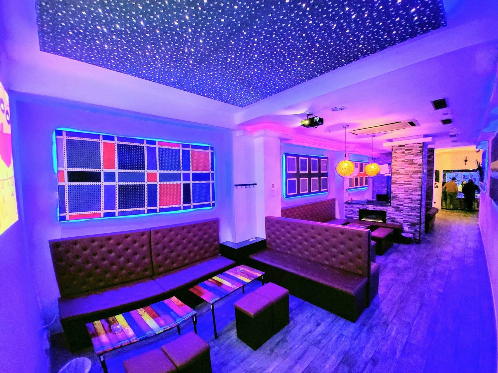 Futuristic lounge of the cannabis association Smoke Signals in Barcelona with neon lighting